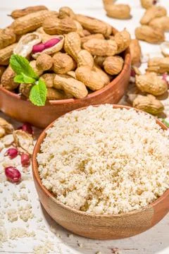 Peanut flour with whole nuts Stock Photos