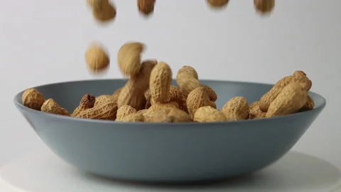 Peanut (Groundnut) Falling to Plate Slow Motion Stock Footage 162546653