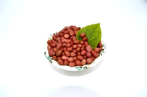 Peanut with leafs on white background Stock Photos
