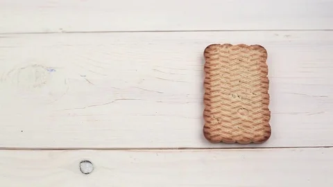 Peanut paste spread on cookies Stock Footage 83759257