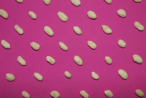 Peanut pattern on a pink background, top view Stock Photos