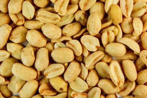 Peanut. peanuts close up. roasted fragrant delicious salted grains of peanuts Stock Photos