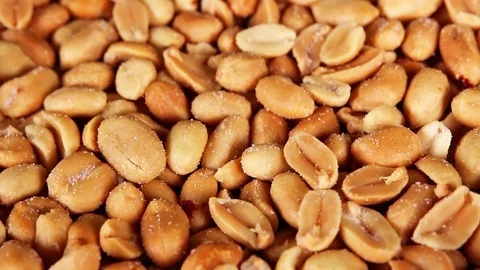 Peanut peanuts texture closeup on rotating plate Stock Footage 98493792