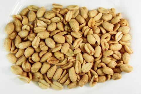Peanut. peanuts on a white background. roasted fragrant delicious grains Stock Photos