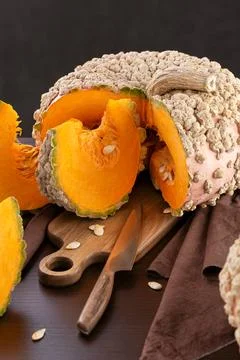 Peanut pumpkin Galeuse d Eysines And Wedges Prepared On Kitchen Table Stock Photos