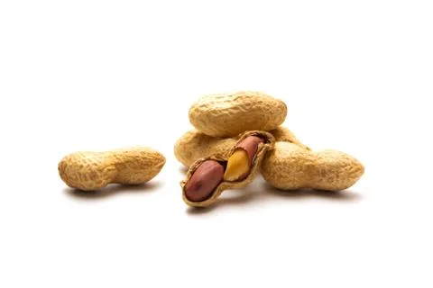 Peanut in a shell isolated on white background. Dried peanuts in closeup. Stock Photos