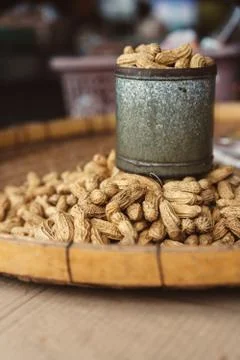 Peanut with a shell in metal jar Stock Photos