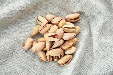 Peanut shells food background, close-up, shallow depth of field, macro. Stock Photos