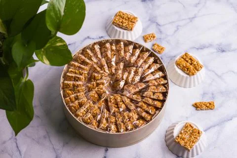 Peanut sweets cube served in a dish isolated on grey background top view of d Stock Photos