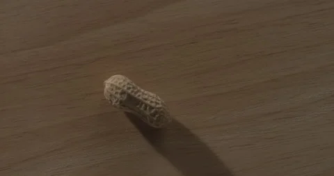 Peanut on wood table Stock Footage 146423375