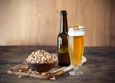 Peanuts and a beer Stock Photos