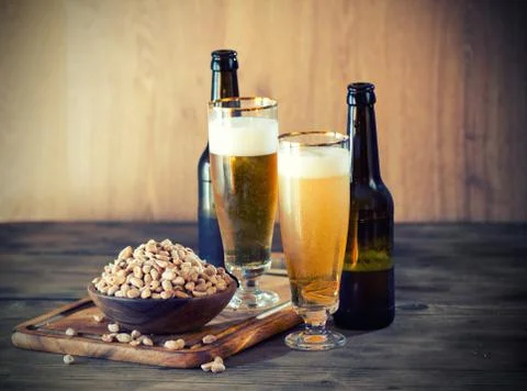 Peanuts and a beer 库存照片