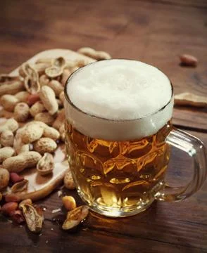 Peanuts and beer Stock Photos