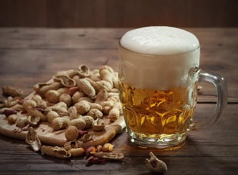 Peanuts and beer Stock Photos
