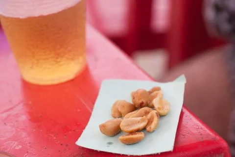Peanuts and beer Stock Photos