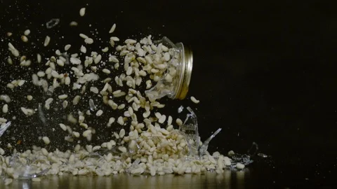 Peanuts and broken glass falling, Ultra Slow Motion Stock Footage 86584427