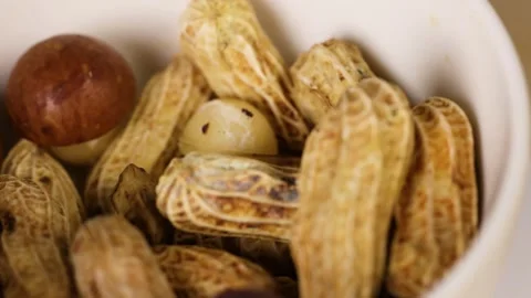 Peanuts and Nuts in a Bowl Stock Footage 306197647