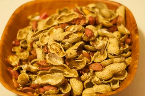 Peanuts and shells food background texture. Shallow dof. Stock Photos