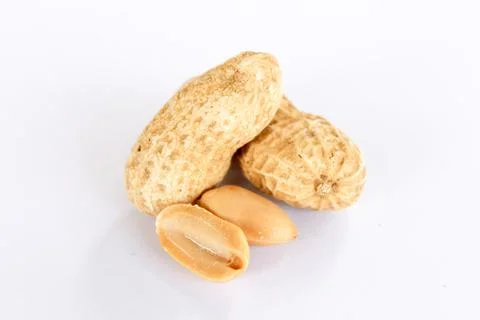 Peanuts are on a white background. There was a peanut seed that had been carv Stock Photos