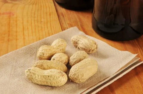 Peanuts on a bar napkin Stock Photos