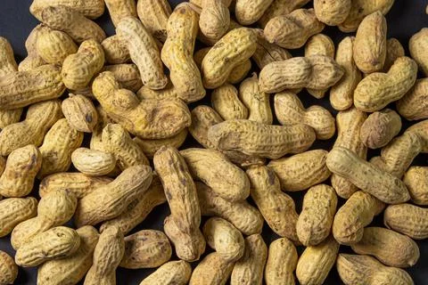 Peanuts on a black background. Full screen peanuts.  Stock Photos