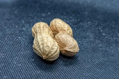 Peanuts on black background Stock Photos