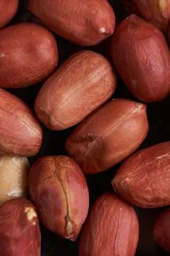 Peanuts on black background. Stock Photos