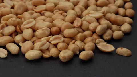 Peanuts in a black bowl Video stock 297983573