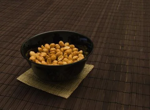 Peanuts in black can 스톡 사진