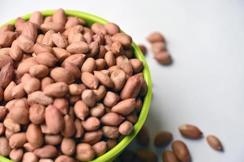 Peanuts in Bowl Angled Top View with Defocus Background Macro Photography Stock Photos
