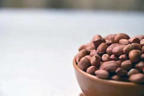 Peanuts in Bowl Front View with Defocus Background Macro Photography Stock Photos