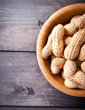 Peanuts in bowl Stock Photos