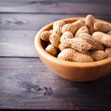 Peanuts in bowl Stock Photos