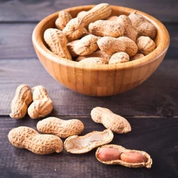 Peanuts in bowl Stock Photos