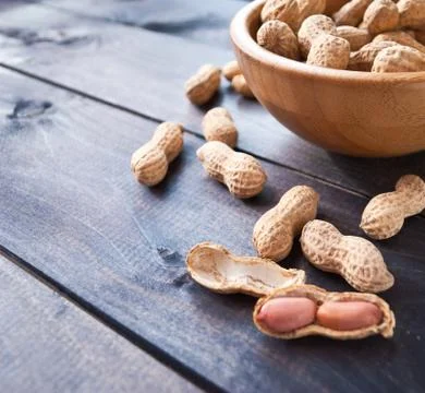 Peanuts in bowl Stock Photos