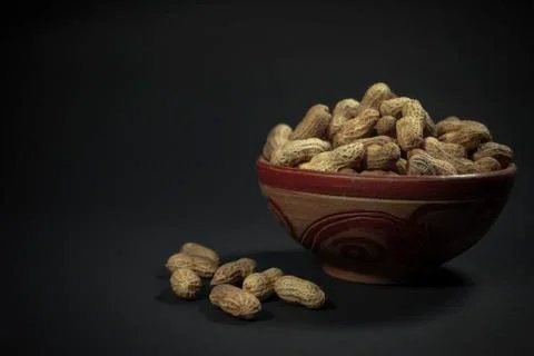 Peanuts in bowl Stock Photos