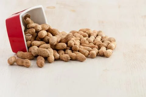 Peanuts in bowl Stock Photos