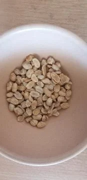 The peanuts in a bowl Stock Photos
