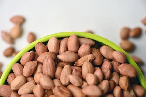 Peanuts in Bowl Top View with Defocus Background Macro Photography Stock Photos