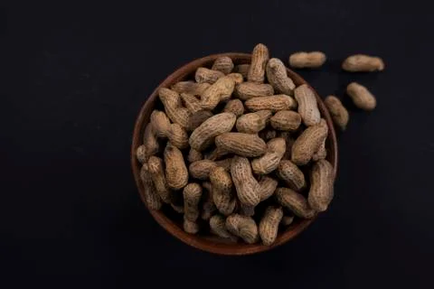 Peanuts in bowl top view Stock Photos