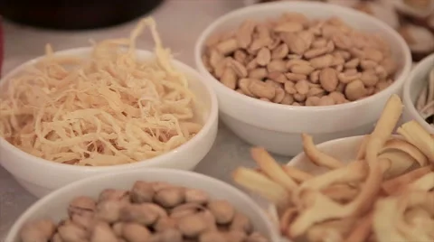 Peanuts, cheese, squid on plate Stock Footage 61757779