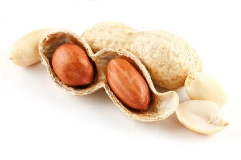Peanuts closeup in shell and peeled on a white background Foto stock