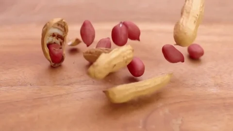 Peanuts drop in macro and split in super slow motion Stock Footage 76888731