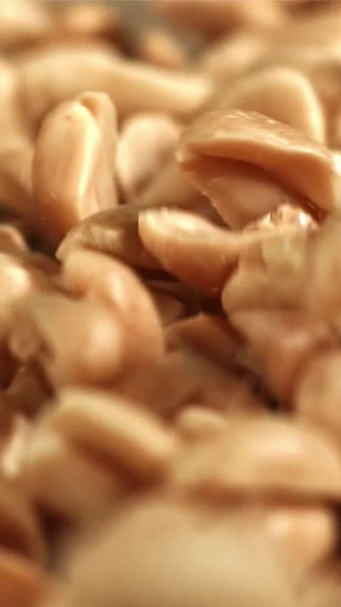 Peanuts fall on the table. Filmed on a high-speed camera at 1000 fps Stock Footage 335323400