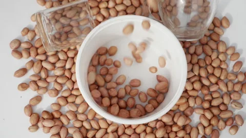 Peanuts fall from the top into a basket. Stock Footage 139746387