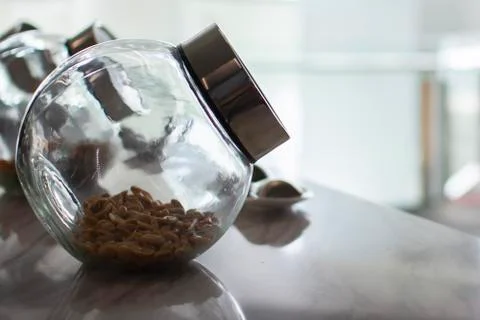 Peanuts in glass jars, soft light tones Stock Photos
