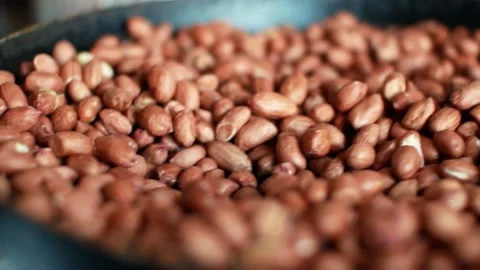 Peanuts groundnuts roasted in a pan on the gas burner. Cooking close-up  Stock Footage 133740218