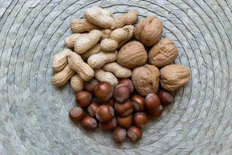 Peanuts, Hazelnuts and Walnuts with Nutshells Mix Stock Photos