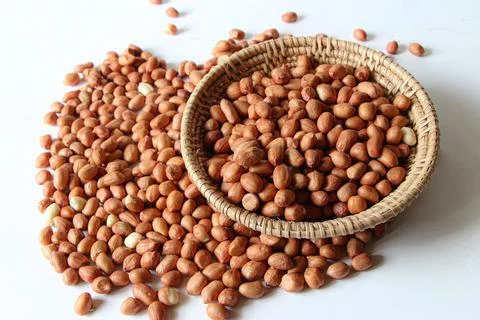 Peanuts isolate on a white plate on a white background roasted salted Stock Photos
