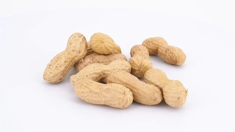 Peanuts isolated on white background, dolly out shot Stock Footage 85012451